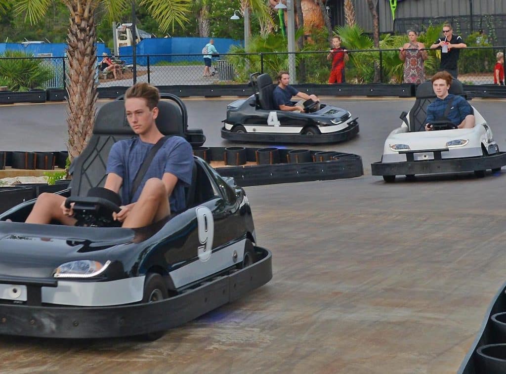 Speeding along the racetrack in electric go-karts at Swampy Jack's Wongo Adventure in Panama City Beach, Florida